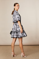 Fee G short stripe floral print dress with raffia belt and tiered skirt, side view