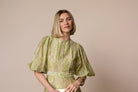 Fee G Kate green paisley midi dress showing puff sleeves and fitted waist