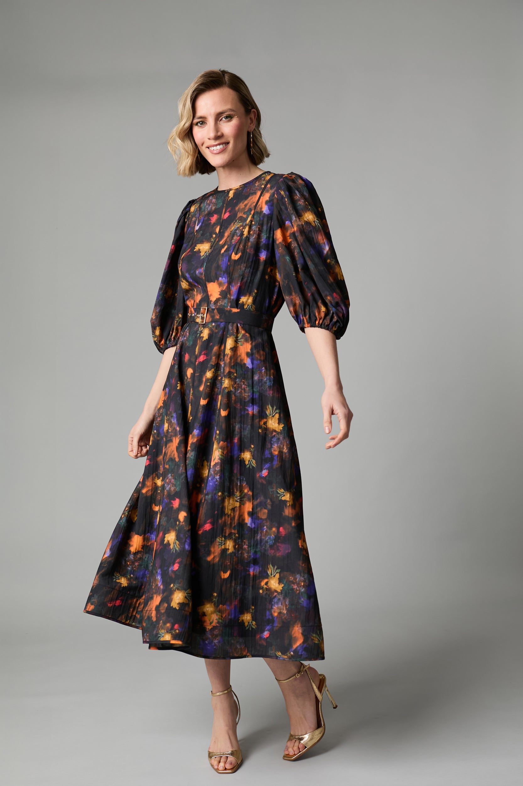 Fee G Kate black floral midi dress shown from a three-quarter angle
