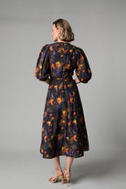  Back view of Fee G Kate black floral puff sleeve midi dress