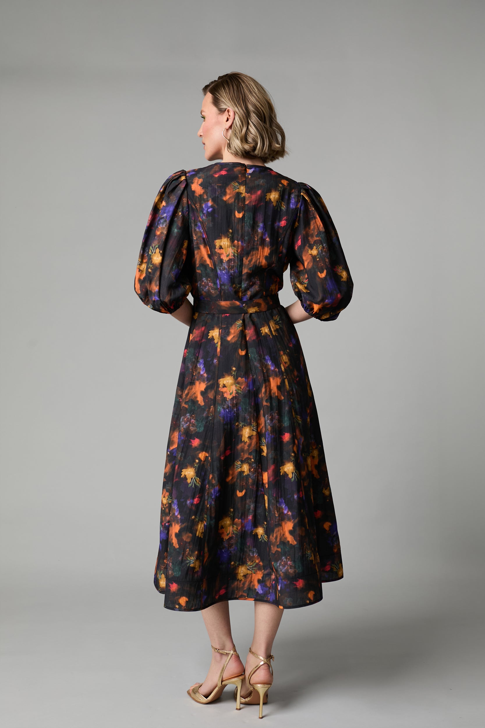 Back view of Fee G Kate black floral puff sleeve midi dress
