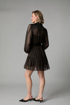 Back view of Fee G Harriet mini dress with sheer sleeves