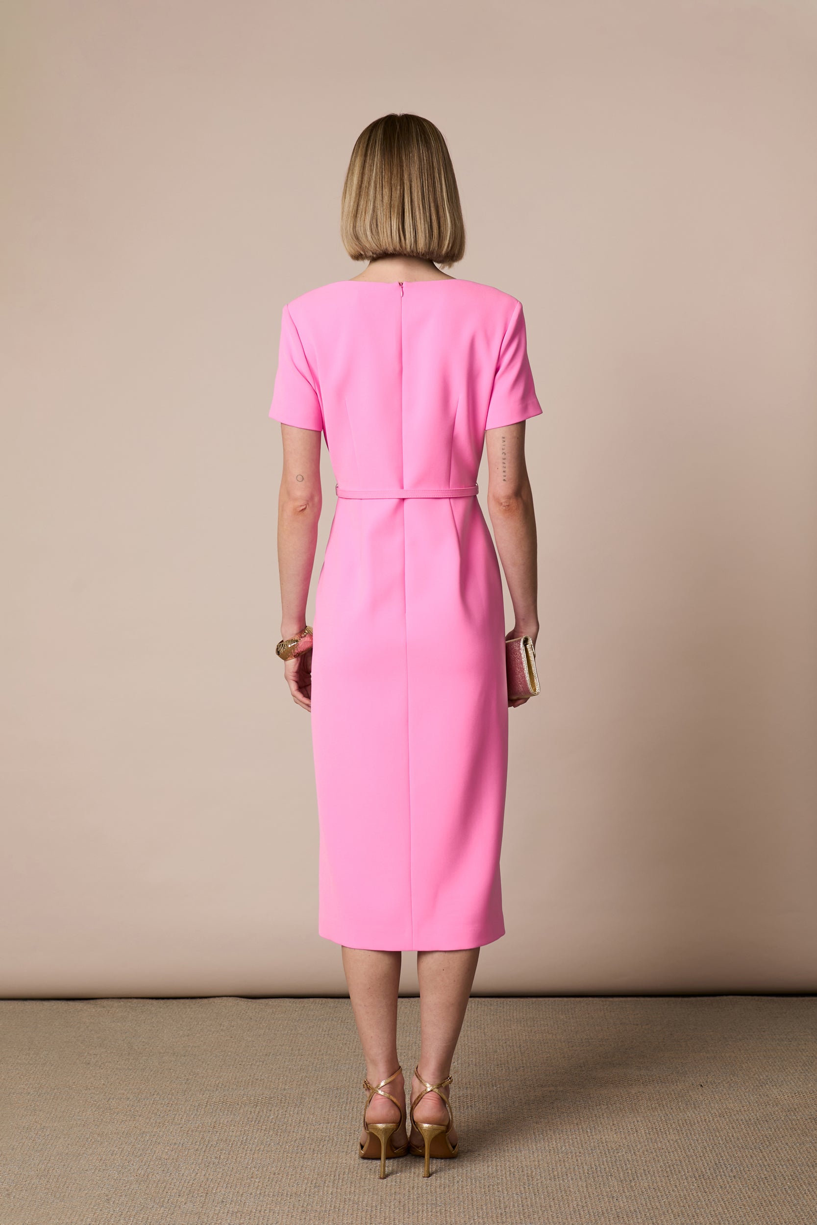 Full-length front view of Fee G Felicity pink tailored occasion dress