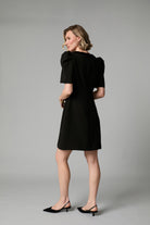 Back view of Fee G Sara black puff sleeve mini dress