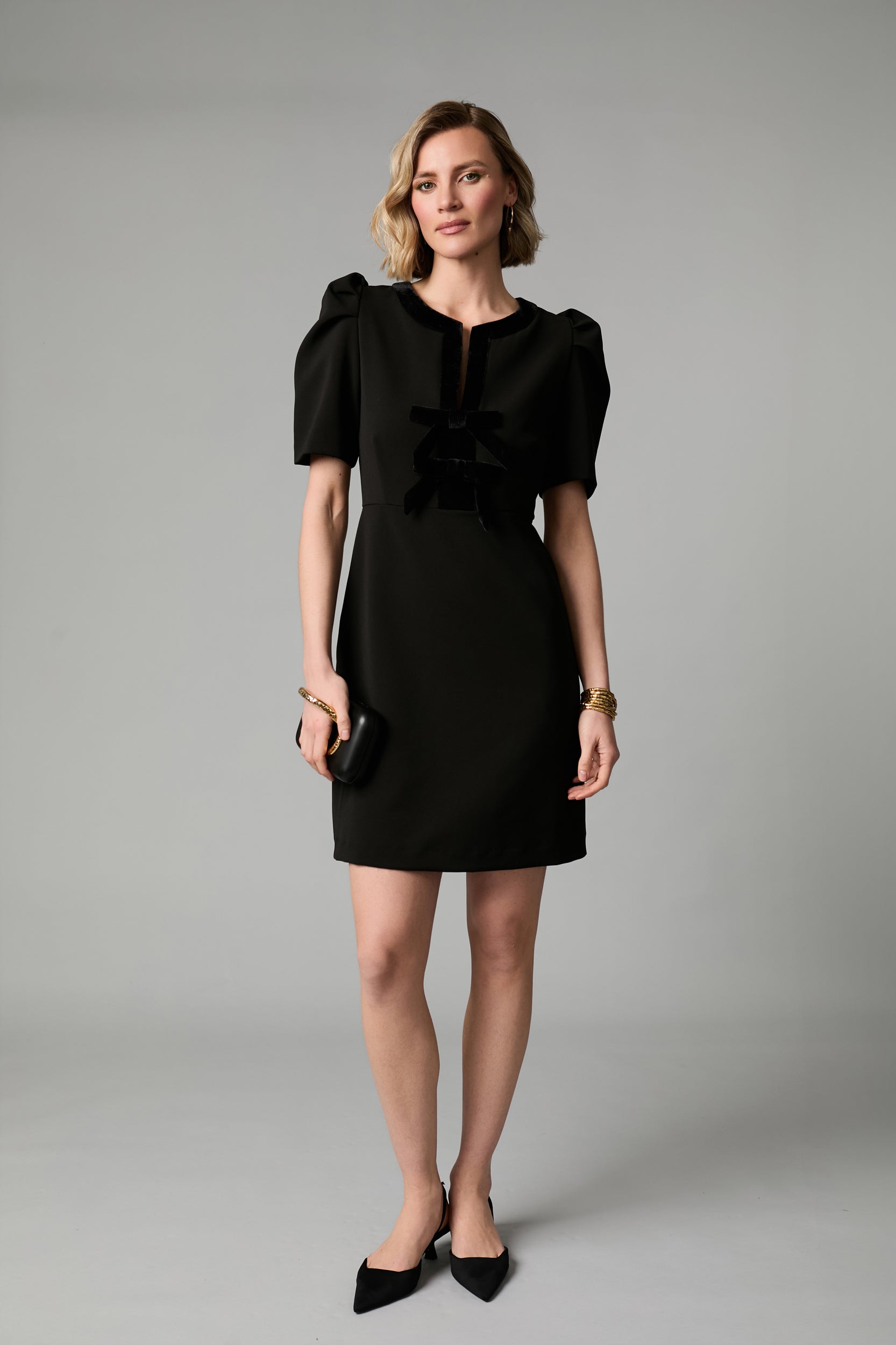 Fee G Sara black velvet bow detail mini dress styled for occasion wear