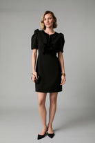Fee G Sara black velvet bow detail mini dress styled for occasion wear
