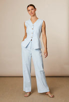 Fee G Jade mismatch button waistcoat in blue cotton with V neckline
