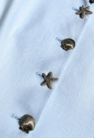 Fee G Jade light blue tailored waistcoat close up view with shell button detail