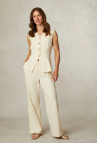 Fee G Jade lemon waistcoat layered with coordinating trousers for suit look