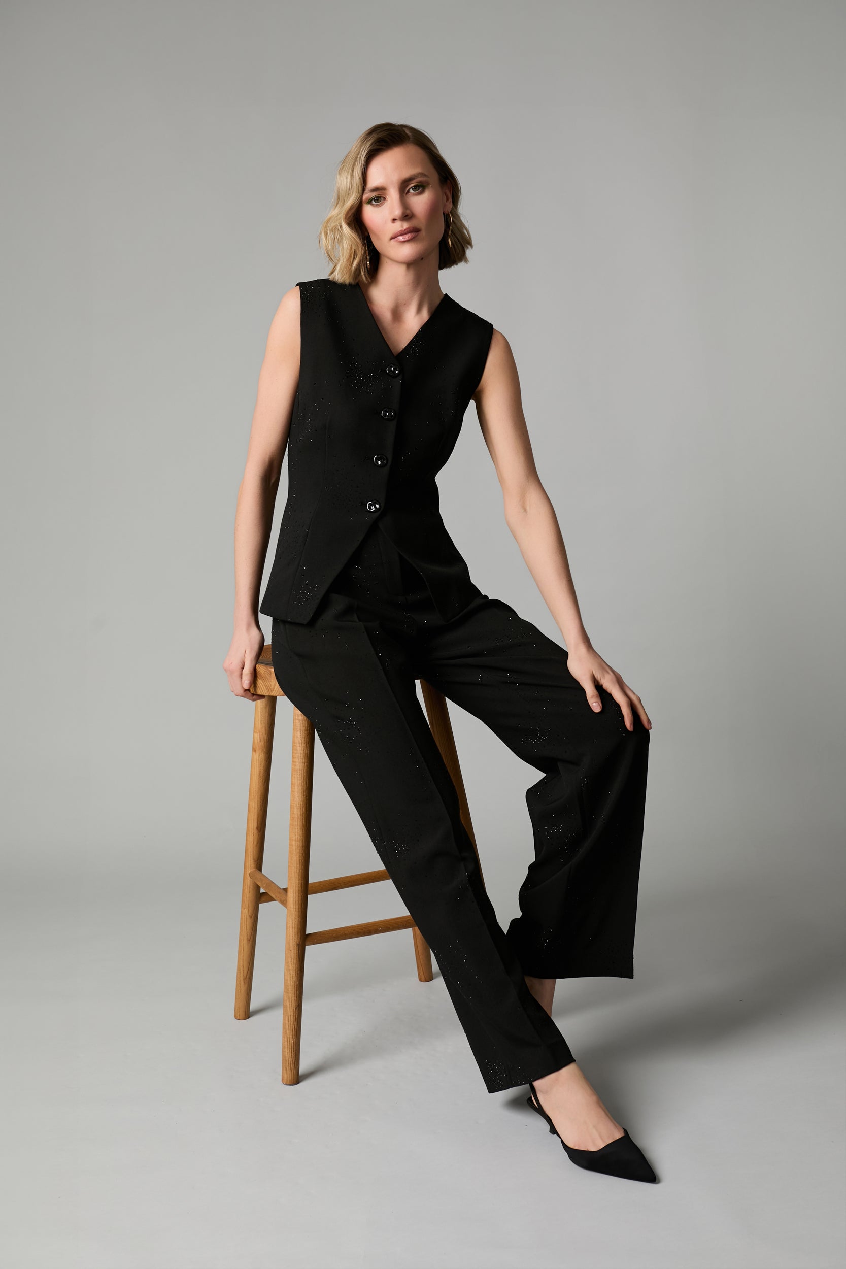 Fee G black crystal embellished fitted waistcoat seated front view