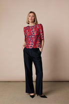 Fee G Lori red navy floral lace bow back top styled with trousers