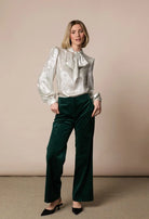 Fee G Amy silky bow tie neck blouse styled with tailored trousers