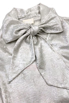 Fee G Amy silky occasion blouse close-up showing statement bow detail