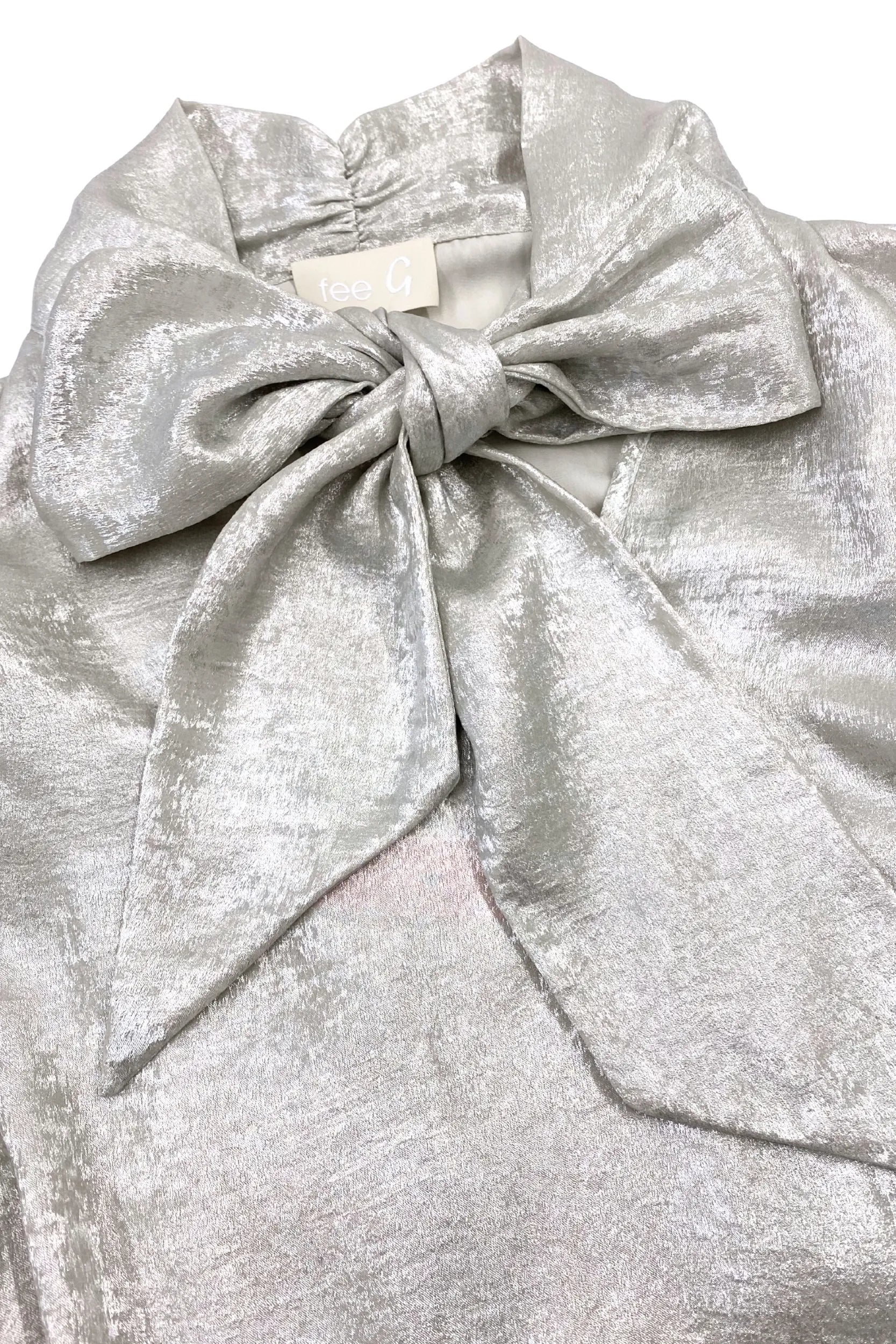 Fee G Amy silky occasion blouse close-up showing statement bow detail