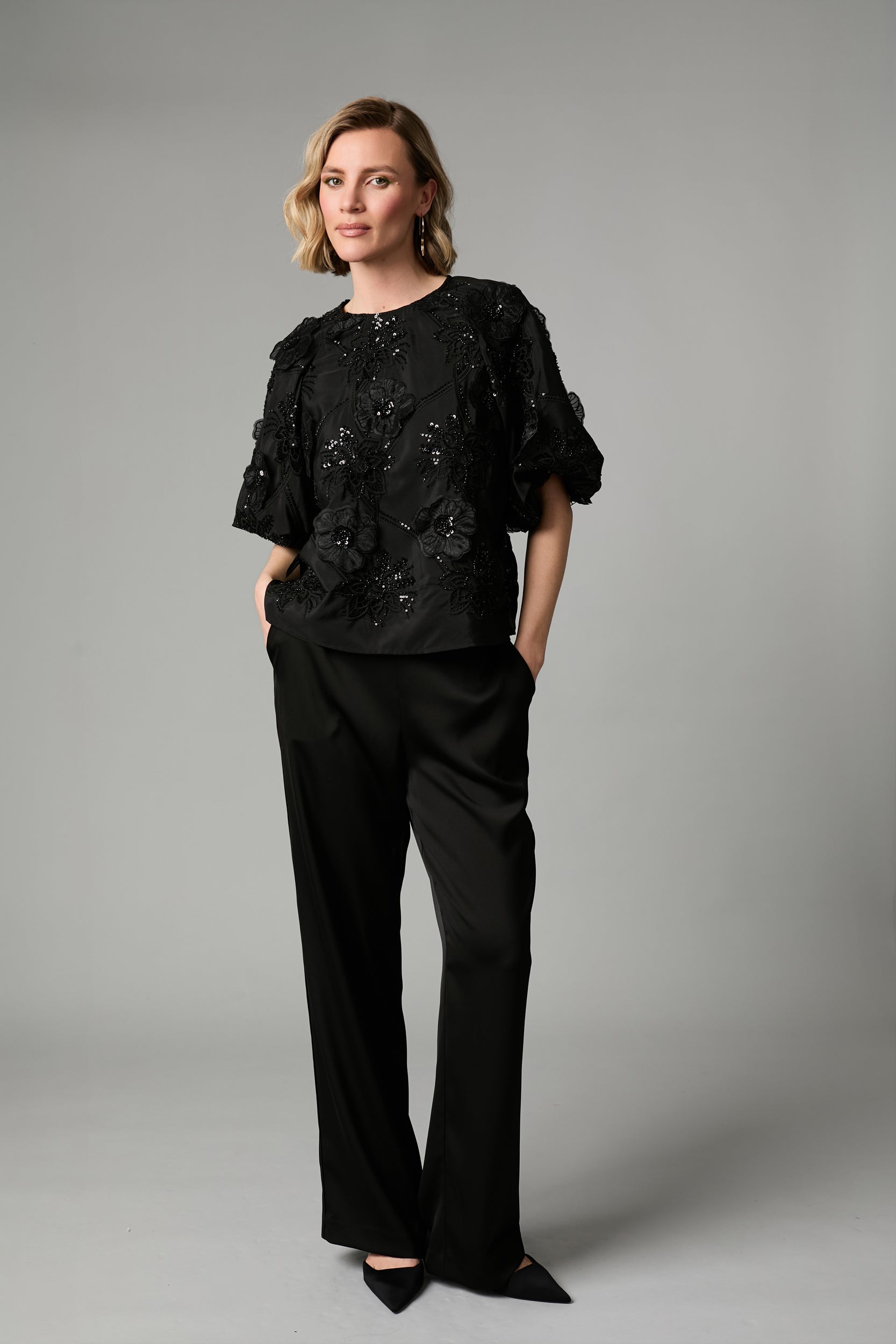 Fee G Renee black embroidered sequin top styled with black trousers