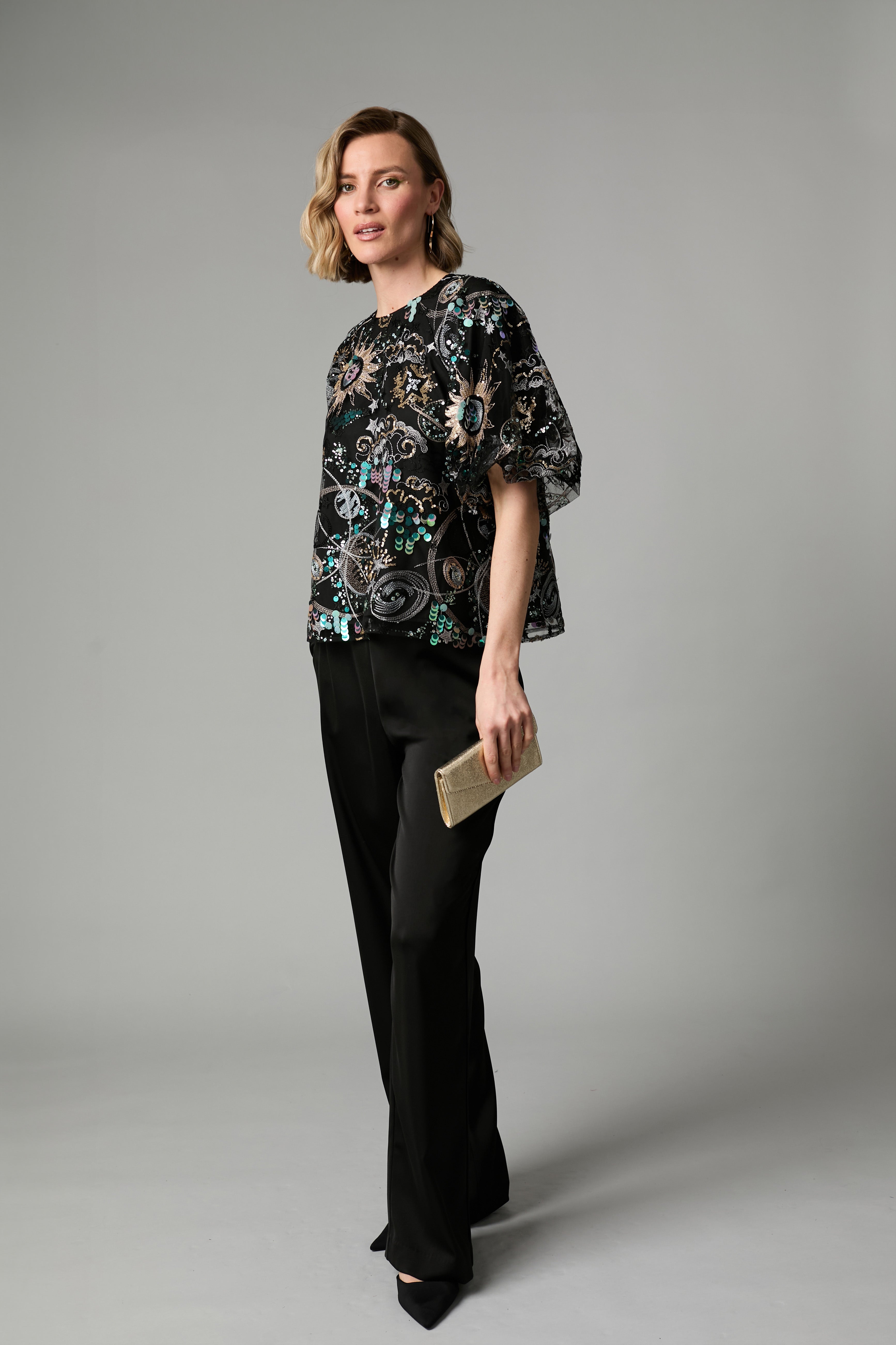 Fee G Stellar black celestial sequin top styled with tailored trousers