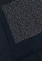 Fee G black pashmina scarf with dark sequin embellishment close-up