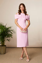 Fee G Phoebe pink midi dress showing sculpted off shoulder statement bow neckline