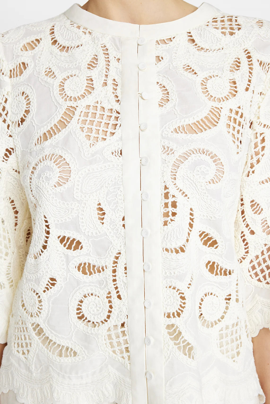 Close-up of embroidered lace and scalloped detail on Gustav white shirt