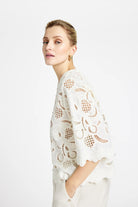 Side view of Gustav Grazia white lace shirt styled for summer