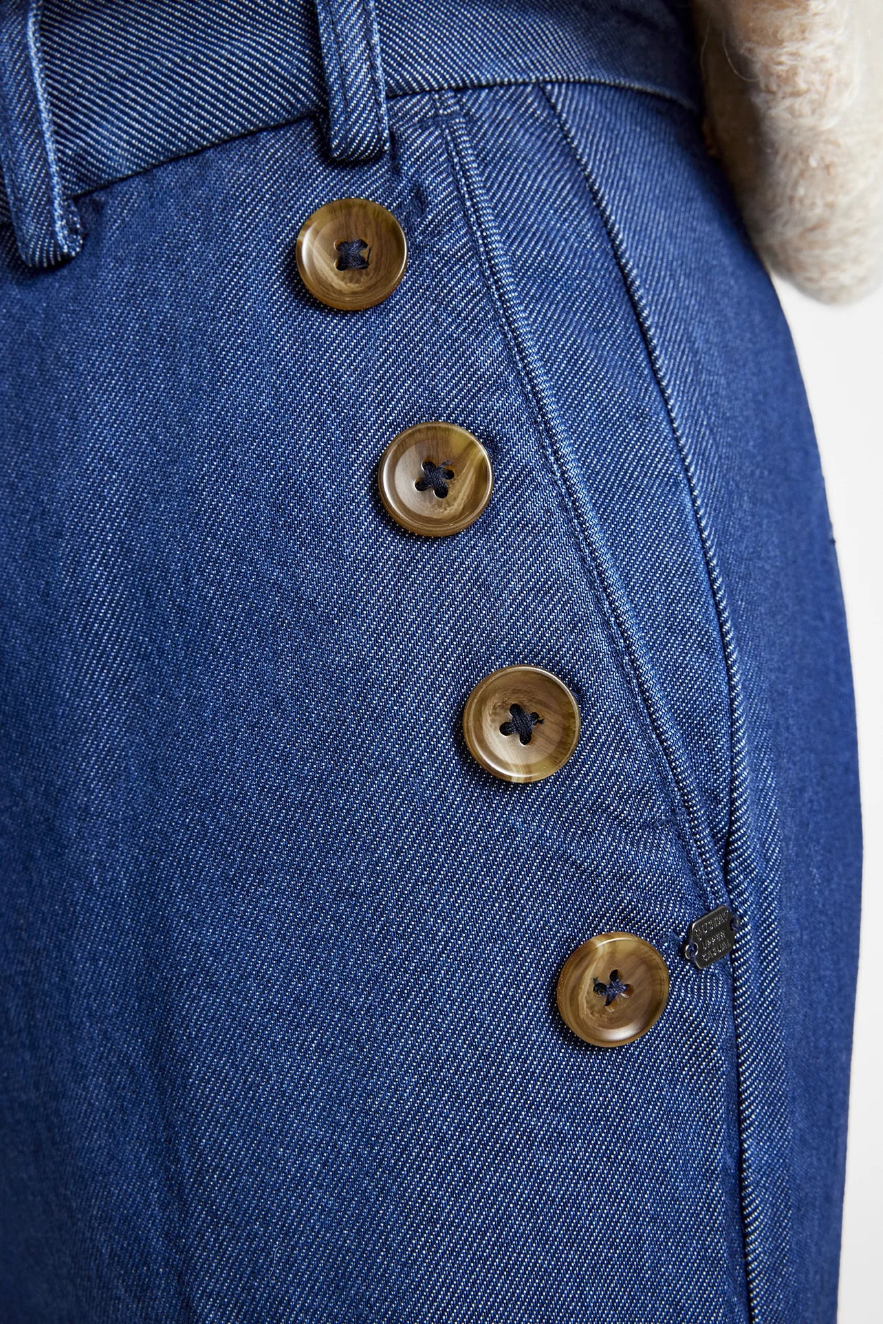 Side view showing button detail on Gustav Cali lyocell tailored denim trousers