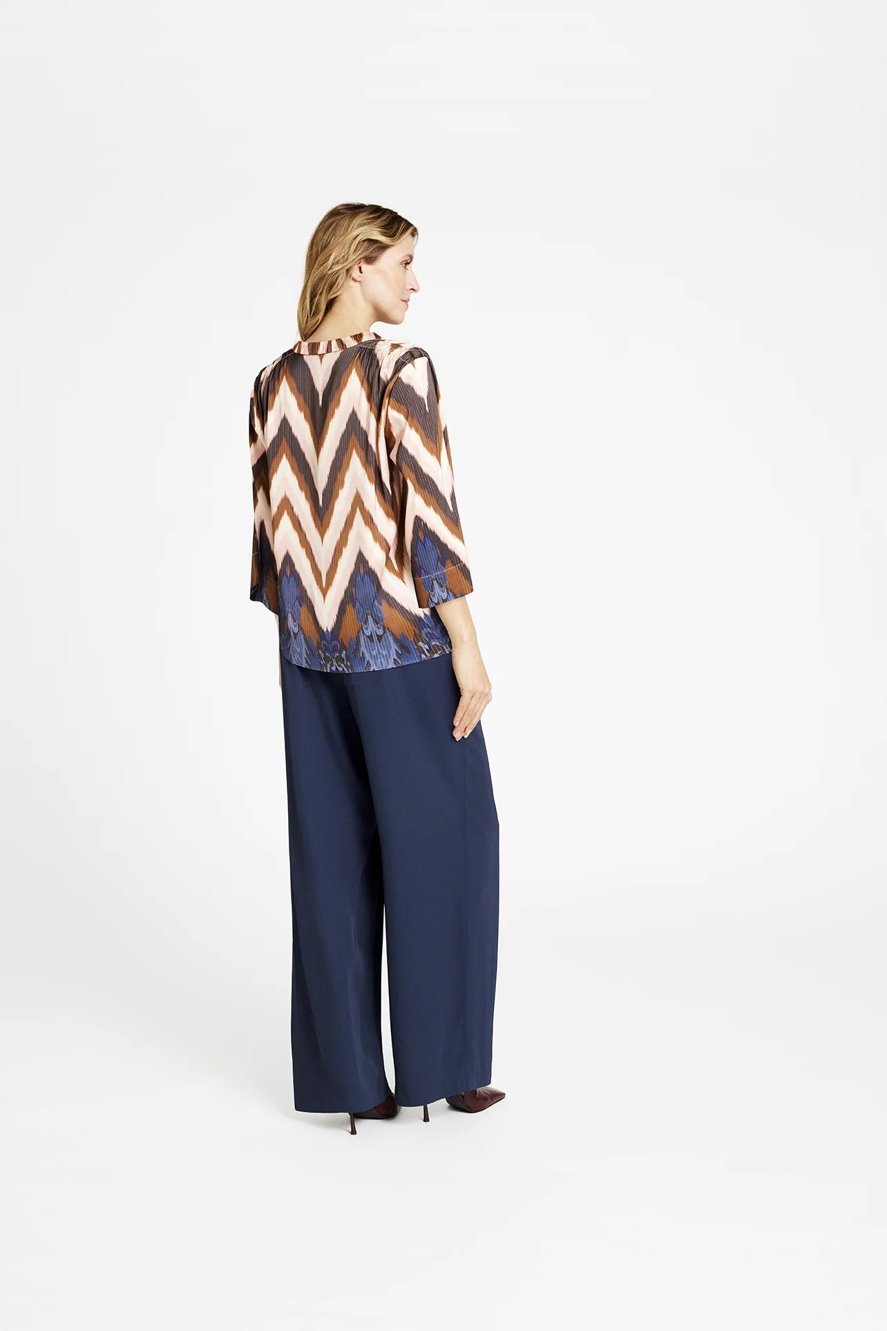Side view of zig zag print blouse with wide sleeves by Gustav