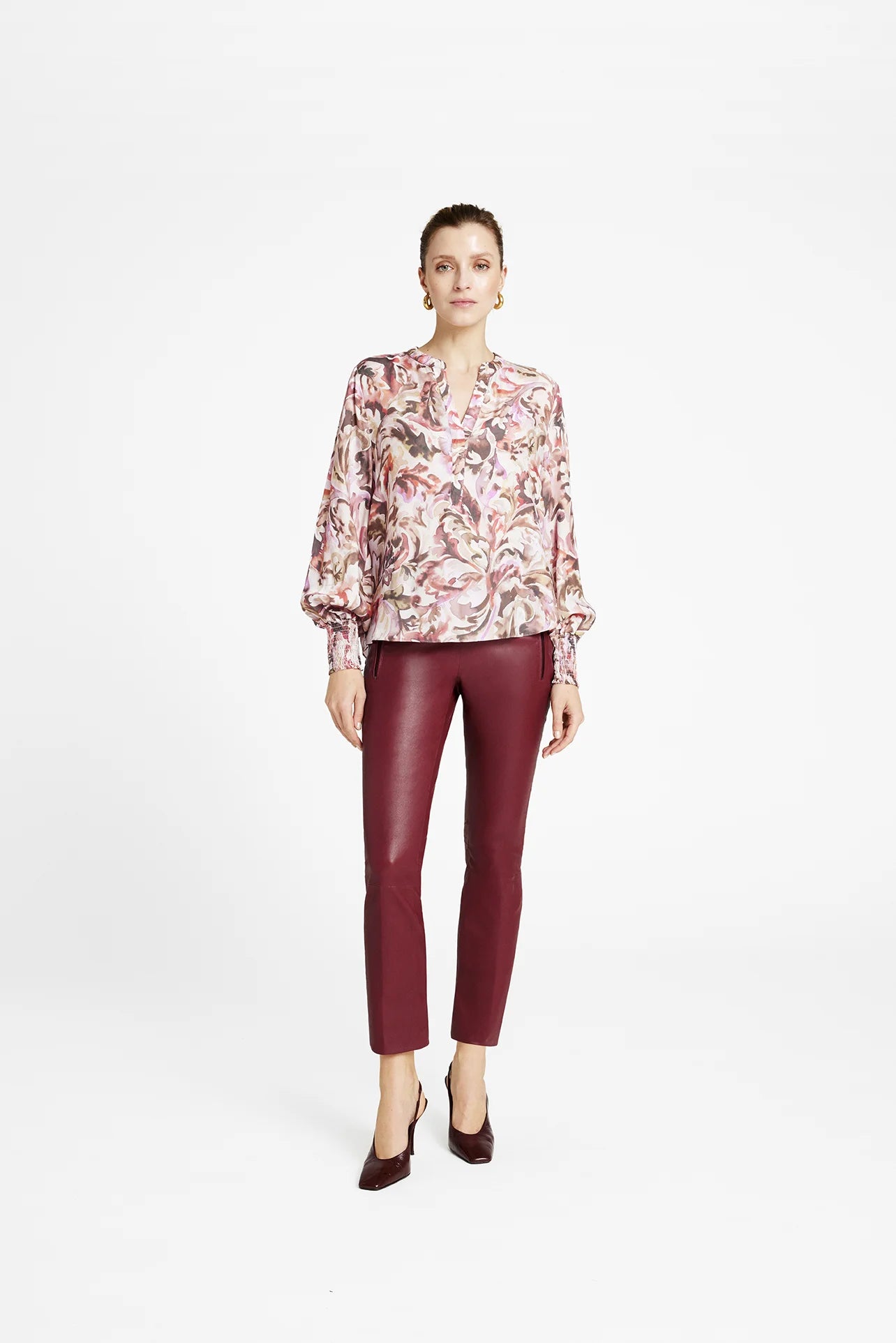 Gustav Cana leaf print blouse styled with burgundy leather trousers
