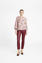 Gustav Cana leaf print blouse styled with burgundy leather trousers
