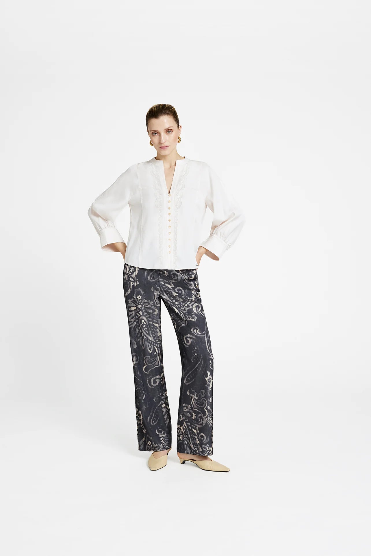 Gustav Kaisa cream lyocell blouse on model — V-neck with scalloped frill placket and cuffed sleeves