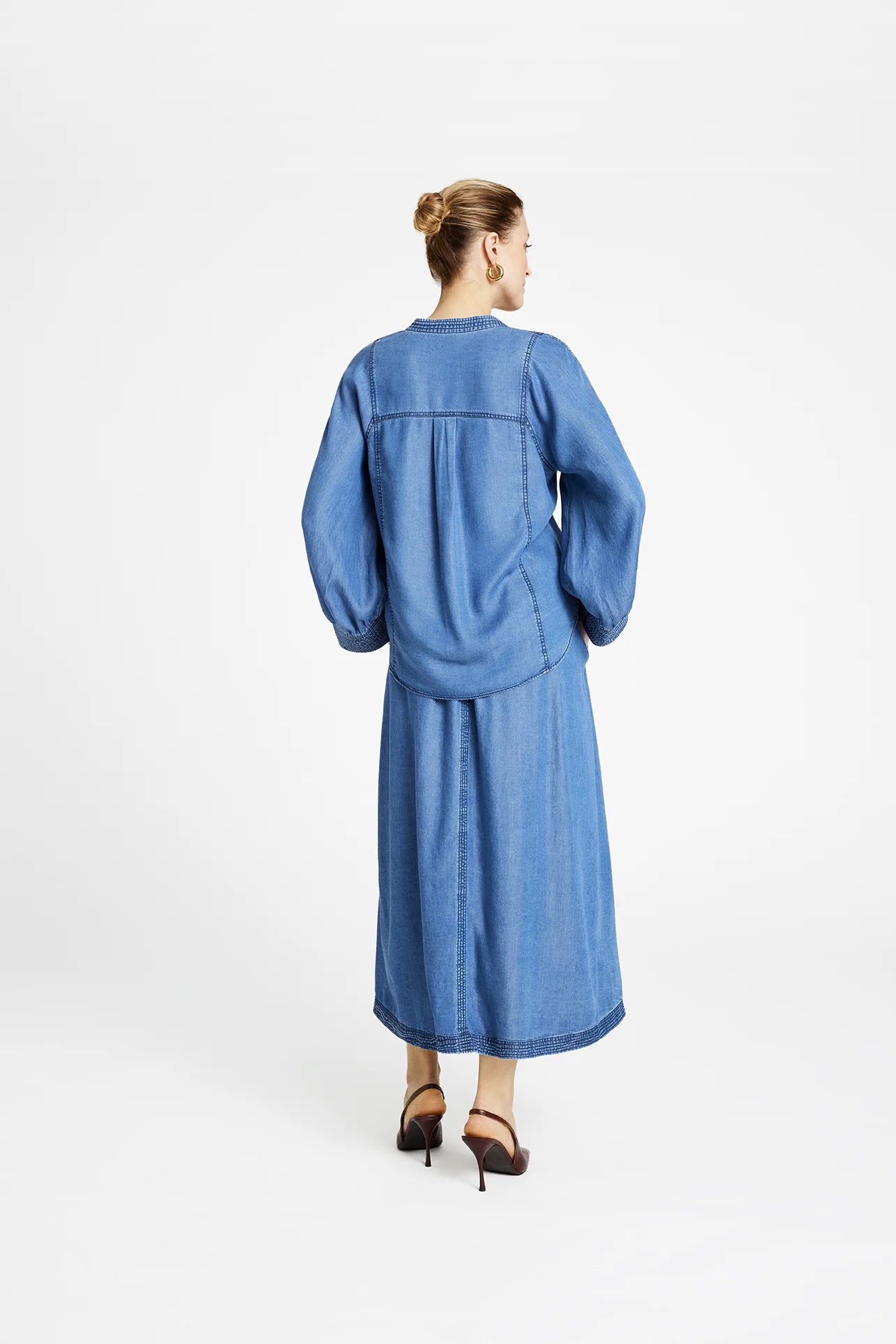 Back view of Gustav Kaisa women’s lyocell frilled blouse in blue denim