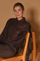 Gustav Ilsa chocolate brown embroidered lace blouse with long sleeves – seated model view