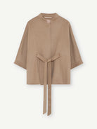 Gustav Dua camel wool blend belted cape style jacket with wide three-quarter sleeves.
