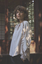 Gustav Annsofie ruffle sleeve blouse in soft almond worn by model