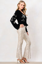 Hope & Ivy Glacia black velvet embellished top with long sleeves – side model view