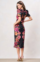 Hope & Ivy Rinna black floral pencil midi dress with puff sleeves – back model view