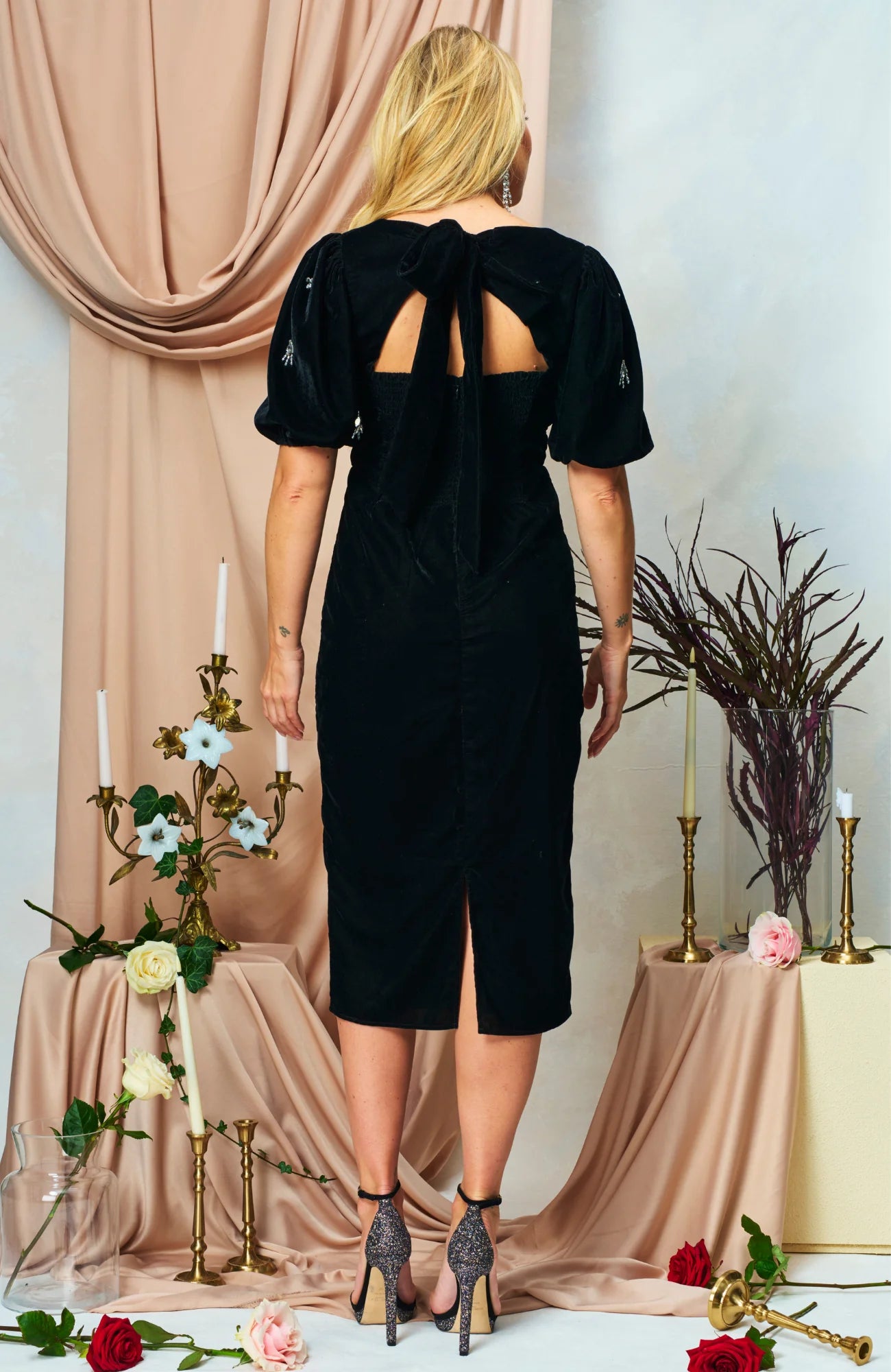 Back view of Hope & Ivy Bettina black dress with oversized bow tie And cut out back 