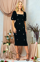 Hope & Ivy Bettina black velvet embellished midi dress styled with heels
