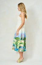 Side profile of Hope & Ivy Celine dress showing Monet-inspired landscape print