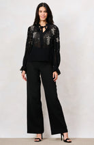 Hope & Ivy Elaris black star embellished mesh top with long sleeves – full front model view