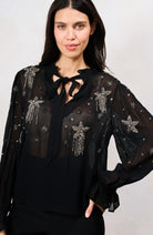 Hope & Ivy Elaris black embellished mesh top with beaded stars – front model close-up