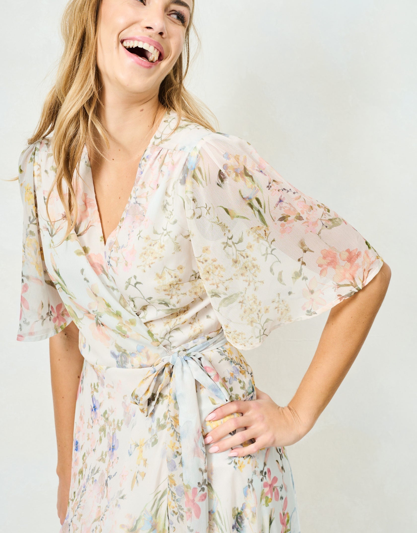 Hope & Ivy Haven wrap neckline and flutter sleeve detail