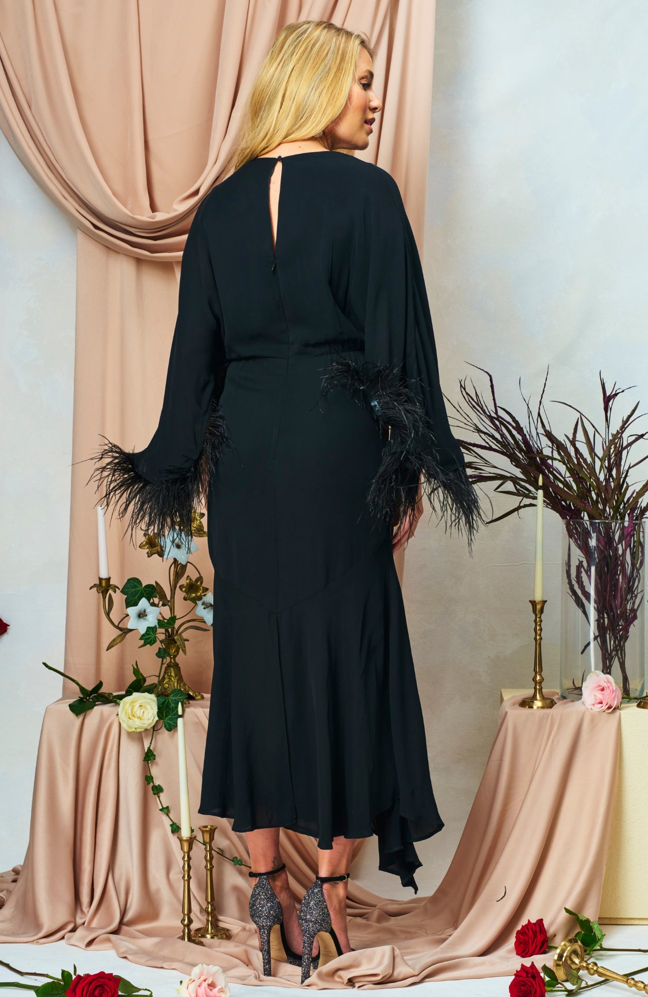 Hope & Ivy Helena event dress with feather-trim sleeves and cascading skirt – back angle