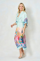Walking pose showing flowy movement of Hope & Ivy reef print summer dress