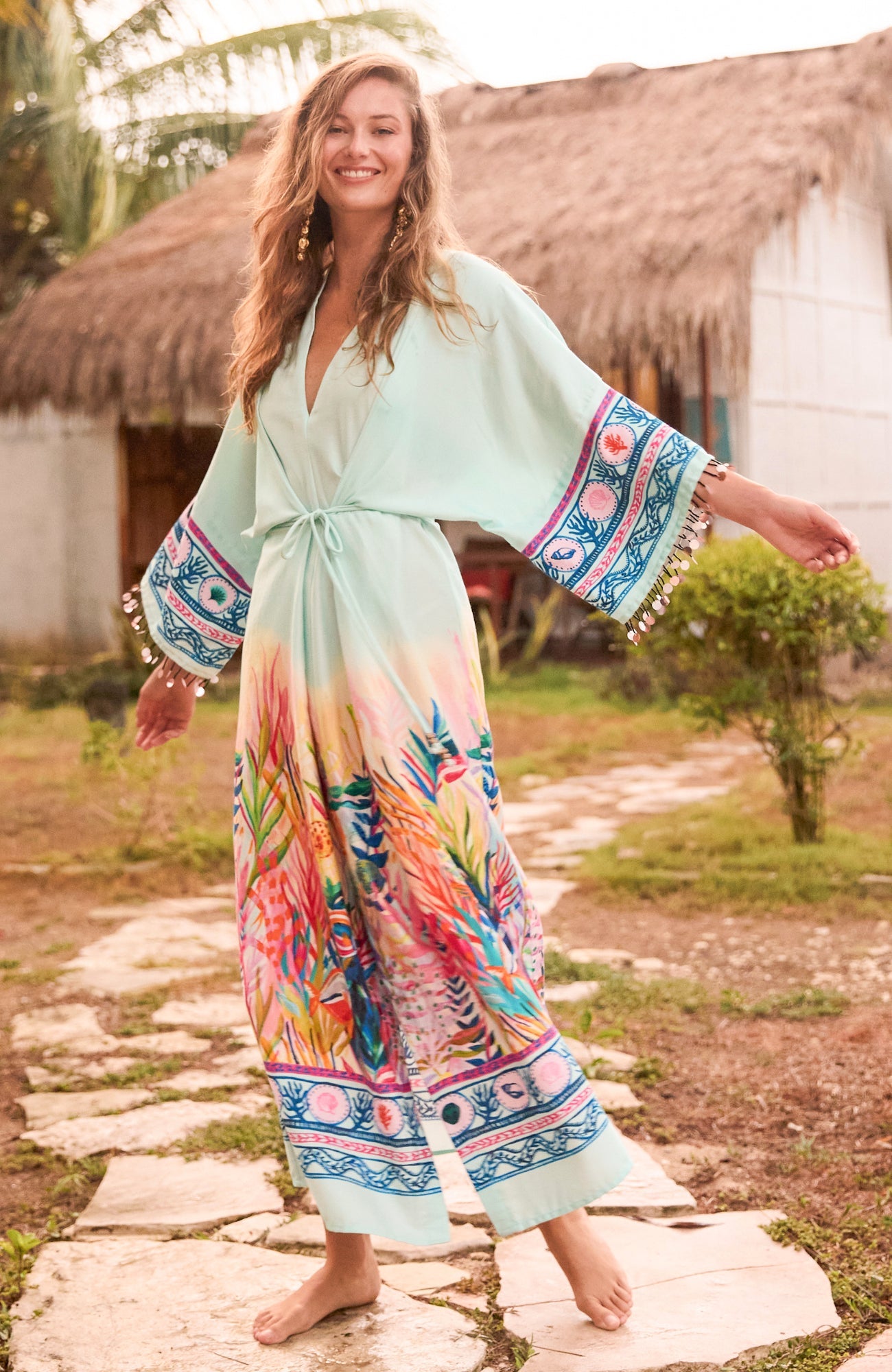 Outdoor lifestyle shot of Hope & Ivy sea print kimono dress in natural lifestyle setting