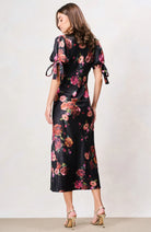 Hope & Ivy Tanya black floral lace-trim midi dress with bow sleeves – three-quarter model view