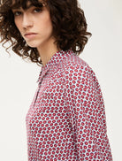 Close-up of painterly red apple print on iBlues Ester shirt