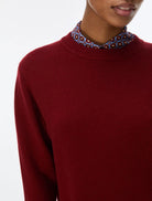 Close-up of iBlues Iblafona burgundy crew neck jumper and ribbed neckline