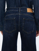 Close-up of iBlues Iblbianca jeans showing back pockets and branded waistband patch