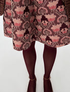 Close-up of iBlues Iblghinea pink lurex jacquard mini skirt and curved hem
