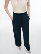 Close-up of iBlues Iblpere dark teal satin trousers with slant pockets